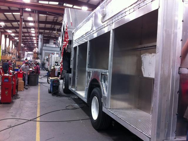 New truck in production at Ferrara Fire Apparatus - Looking up driver's side of truck - 2/21/13